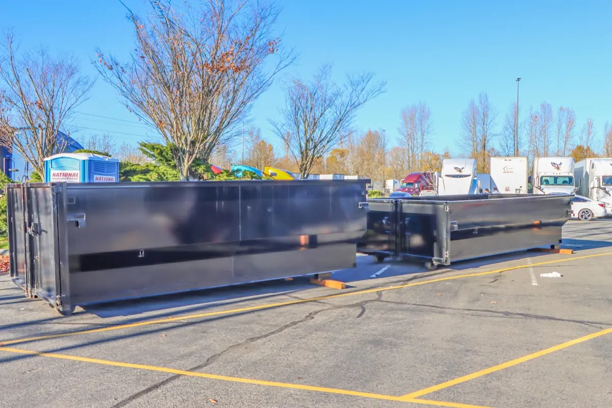 Professional dumpster rental service with roll-off container on residential driveway in Gresham Park